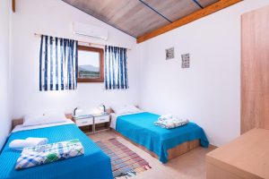 Photo of the two separate beds in the second bedroom of the two-bedroom apartment in the Beachfront villa
