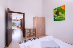 A photo showing the view of the sea right from the bed
