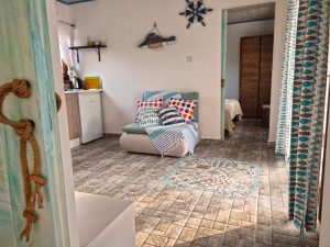 Another photo of the holiday home's living room towards the other bedroom