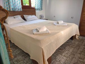 Photo of the large bed in the holiday home on the beach front villa