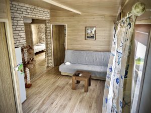 Photo of the living room with the sofa and small table
